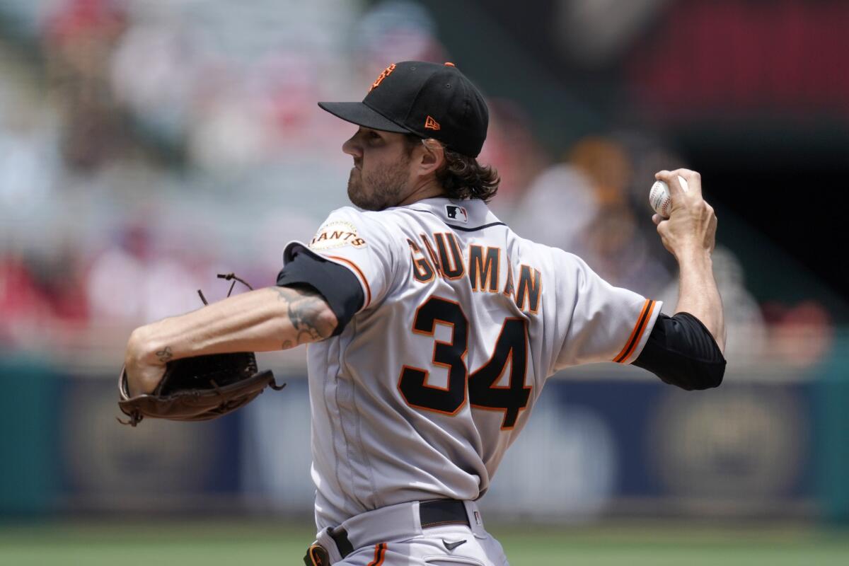 San Francisco Giants starting pitcher Kevin Gausman throws to the plate during the first inning.