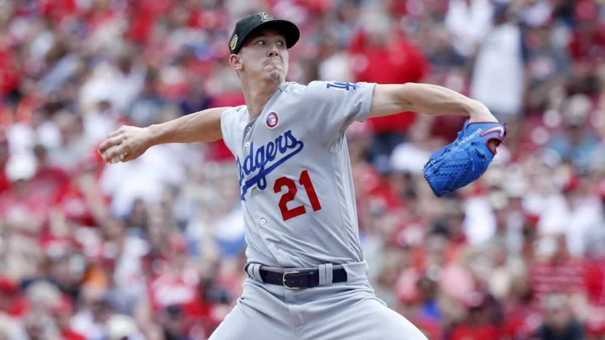 Dodgers starter Walker Buehler delivers in the first inning of a 4-0 loss to the Cincinnati Reds on Saturday.