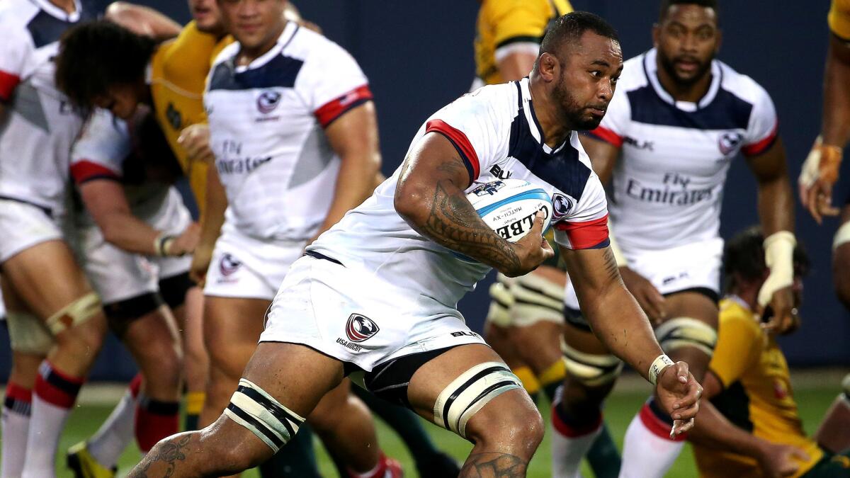 American Samu Manoa advances the ball against Australia during a Rugby World Cup tuneup at Soldier Field in Chicago.