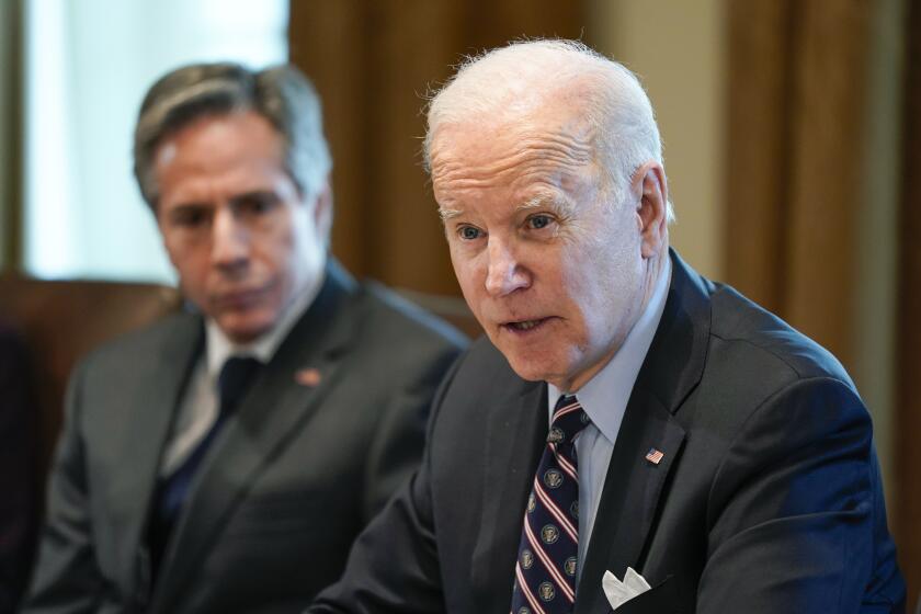 President Joe Biden meets with Colombian President Ivan Duque Marquez in the Cabinet Room of the White House, Thursday, March 10, 2022, in Washington, as Secretary of State Antony Blinken listens. (AP Photo/Patrick Semansky)