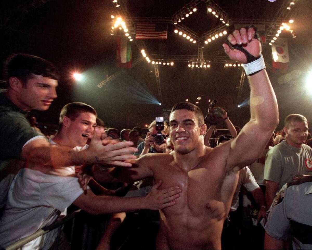 Vitor Belfort acknowledges fans after winning a maatch in 1997.