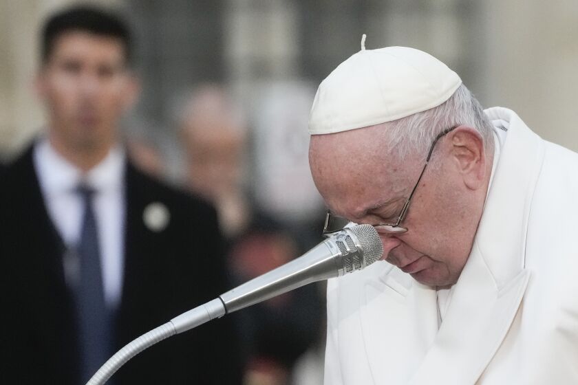 Pope Francis becomes emotional during his prayer in front of the statue of the Virgin Mary, on the occasion of the Immaculate Conception feast in Rome, Thursday, Dec. 8, 2022. (AP Photo/Gregorio Borgia)