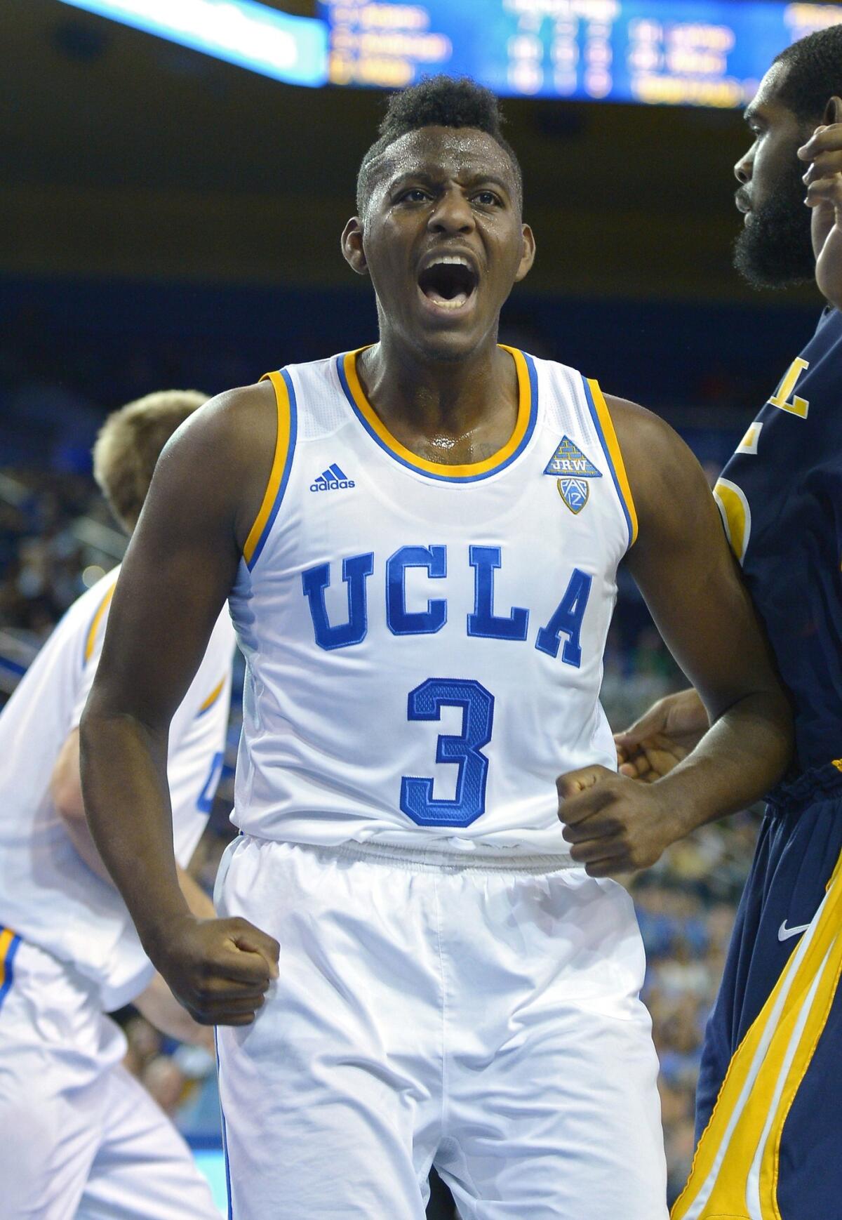 Jordan Adams celebrates after scoring during a game against Drexel in November. The sophomore guard has become a better all-around player for the Bruins this season despite battling adversity on and off the court.