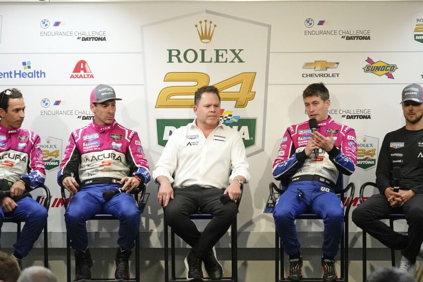 The Meyer Shank Racing team, from left, Helio Castroneves, Simon Pagenaud, Michael Shank, Colin Braun and Tom Blomqvist attend a news conference for the Rolex 24 hour auto race at Daytona International Speedway, Thursday, Jan. 26, 2023, in Daytona Beach, Fla. (AP Photo/John Raoux)