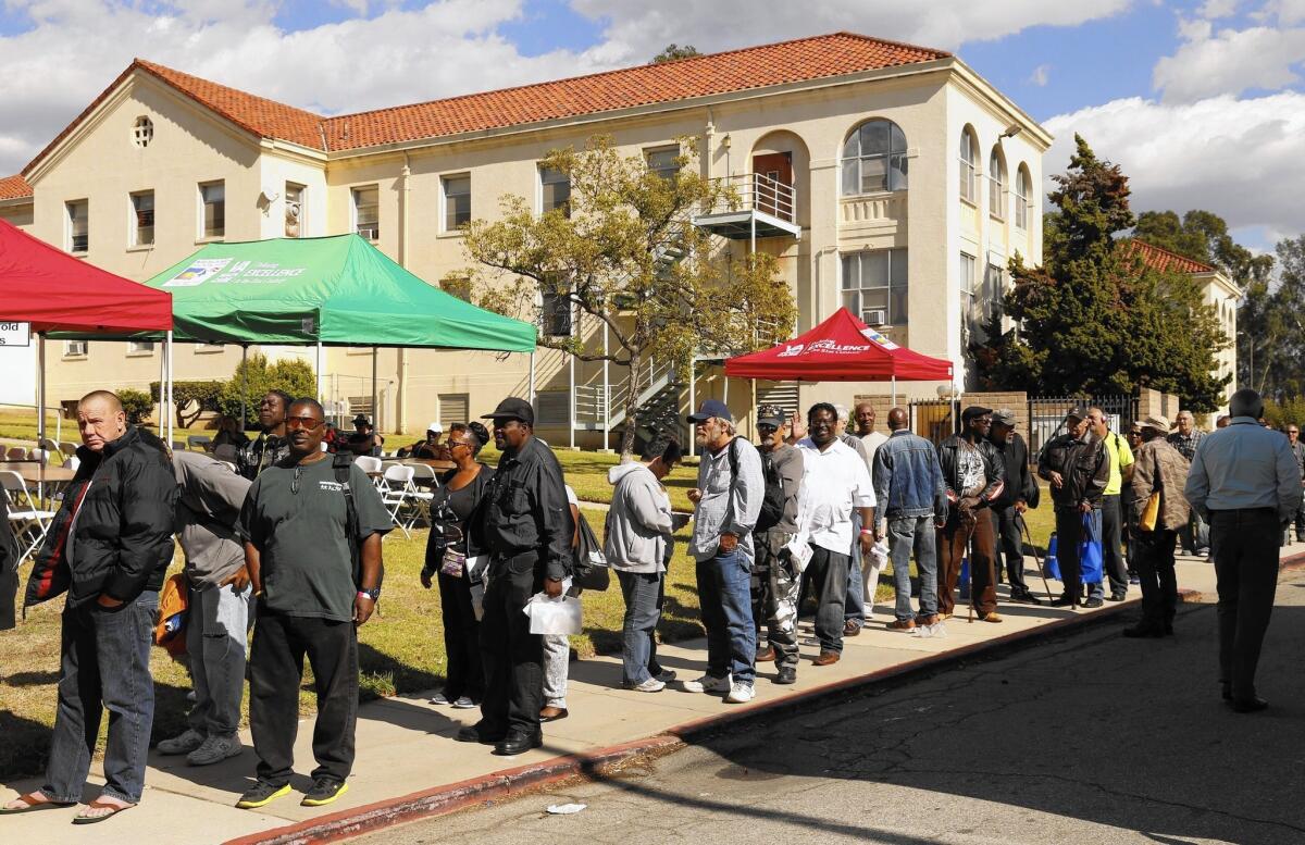 Veterans line up for lunch at West Los Angeles Veterans Affairs campus, where the VA held a stand-down to bring services and support to homeless veterans.