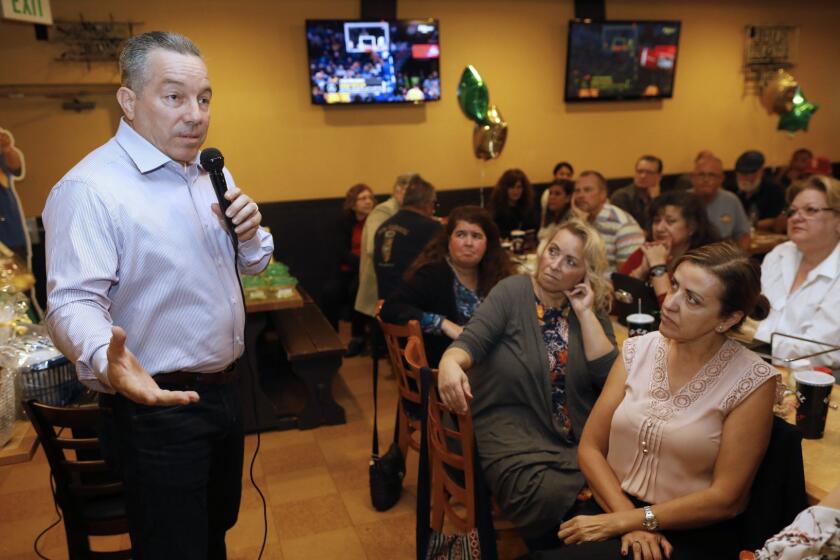 NORWALK, CALIF. -- MONDAY, OCTOBER 29, 2018: Alex Villanueva, candidate for Los Angeles County Sheriff, at a meet and greet fundraiser, at So-Cal Pizza in Norwalk, Calif., on Oct. 29, 2018. (Gary Coronado / Los Angeles Times)