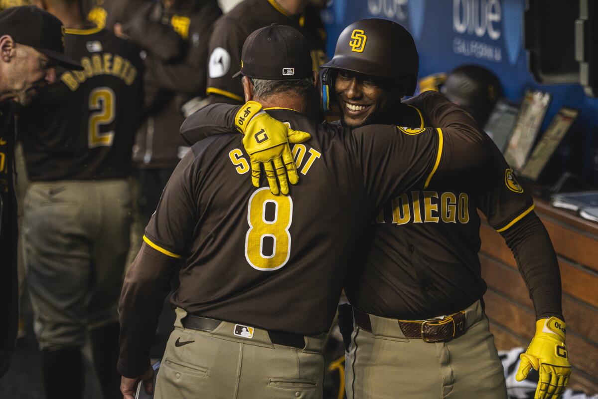 Jurickson Profar hugs Padres manager Mike Shildt during the seventh inning of game against the Dodgers 