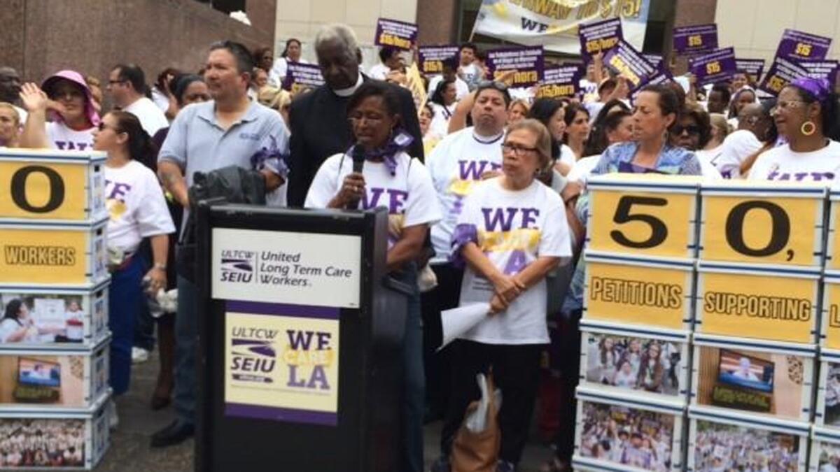 L.A. County in-home services workers rally Tuesday for higher pay outside the Hall of Administration in downtown Los Angeles.