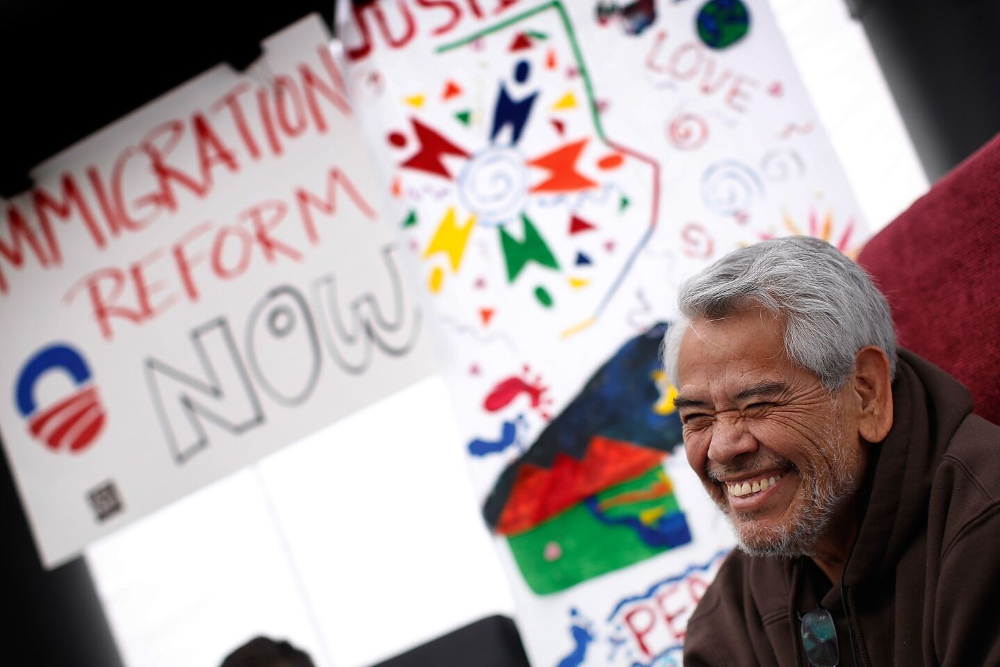 Eliseo Medina, who fasted in support of immigration reform with the Fast for Families movement, talks with fellow fasters on the National Mall in Washington, D.C.