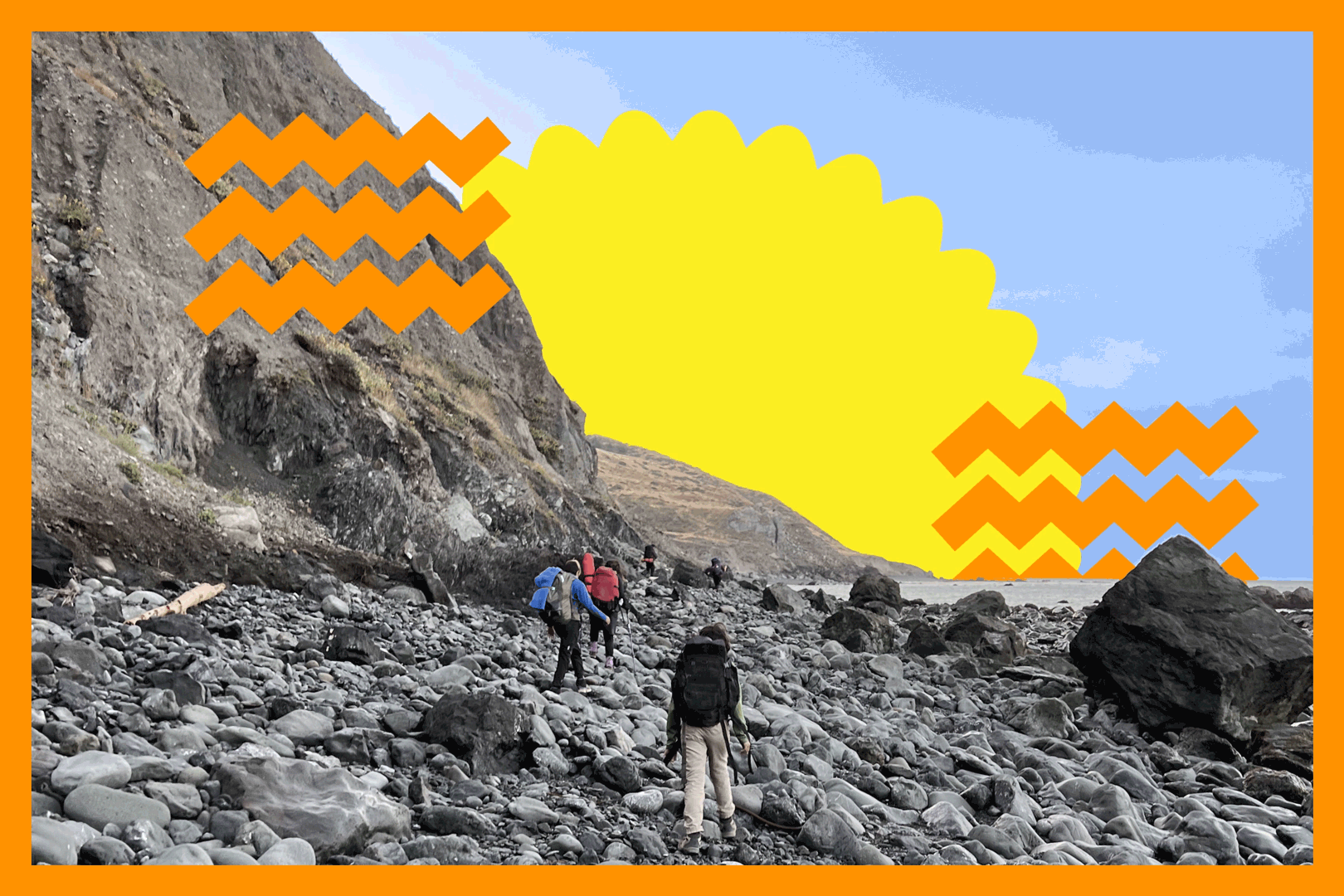 Hikers walk on the rocky beach of the Lost Coast