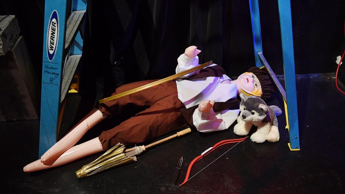 Making magic with a blow-up doll, a stuffed animal, a bow and a knife: some of the props backstage for "Thrones!"