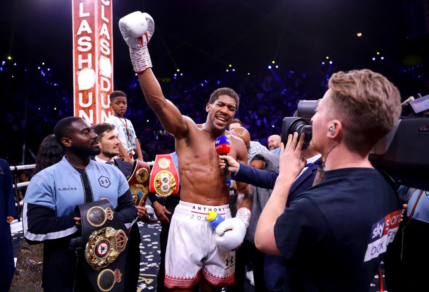 Anthony Joshua raises his arm after a unanimous decision victory over Andy Ruiz Jr. during their heavyweight title fight on Dec. 7 in Diriyah, Saudi Arabia.