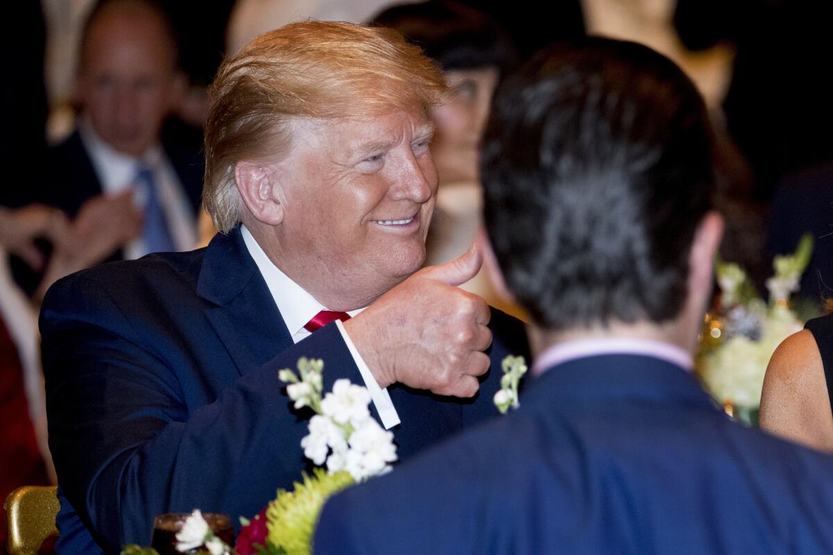 President Trump arriving for Christmas Eve dinner at Mar-a-Lago in Palm Beach, Fla.