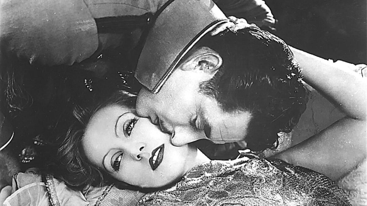 Greta Garbo and John Gilbert warm up the screen in "Flesh and the Devil."