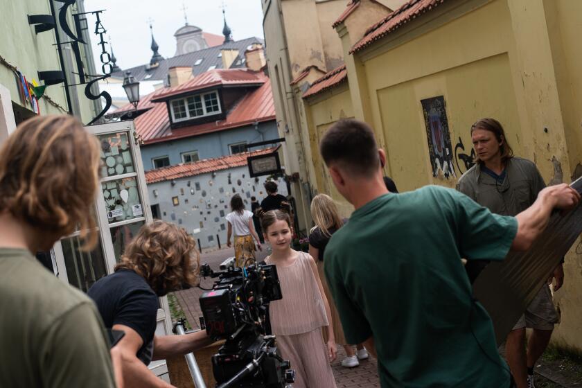 On set of the Lithuanian series Troliu Ferma (Troll Farm), directed by Ernestas Jankauskas (on the left). Vilnius, Lithuania.