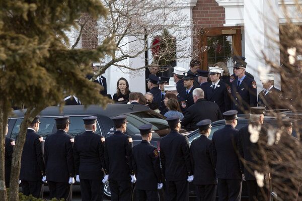 The family of Daniel Barden, 7, a victim of the shooting at Sandy Hook Elementary School, arrives at St. Rose of Lima Church for his funeral Wednesday in Newtown, Conn.