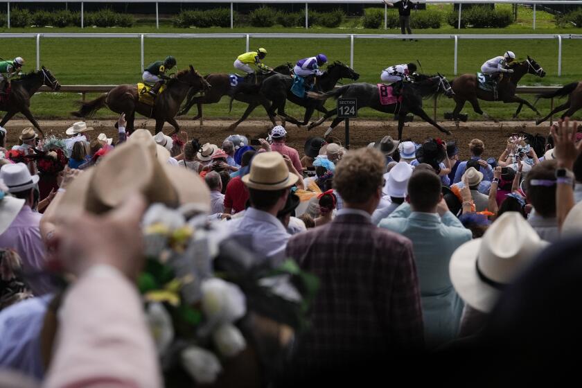 Horses compete during a race at Churchill Downs before the 150th running of the Kentucky Derby horse race Saturday, May 4, 2024, in Louisville, Ky. (AP Photo/Brynn Anderson)