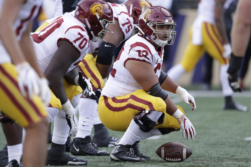 Southern Cal's Brett Neilon lines-up behind the football against Washington in the second half of an NCAA college football game Saturday, Sept. 28, 2019, in Seattle. Washington won 28-14. (AP Photo/Elaine Thompson)