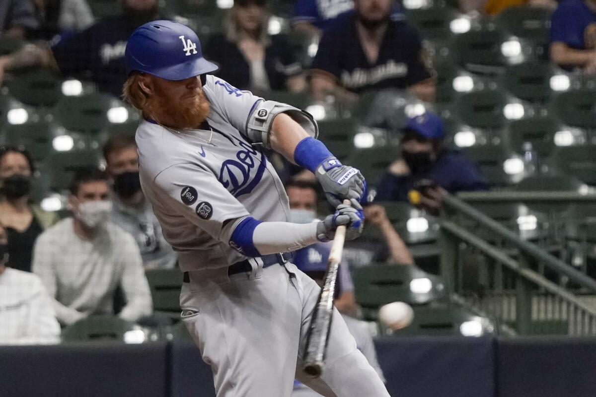 Justin Turner hits a run-scoring single in the 10th inning.