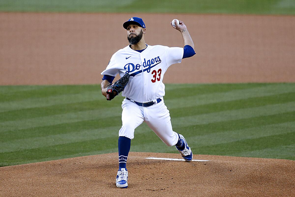 Dodgers pitcher David Price warms up.