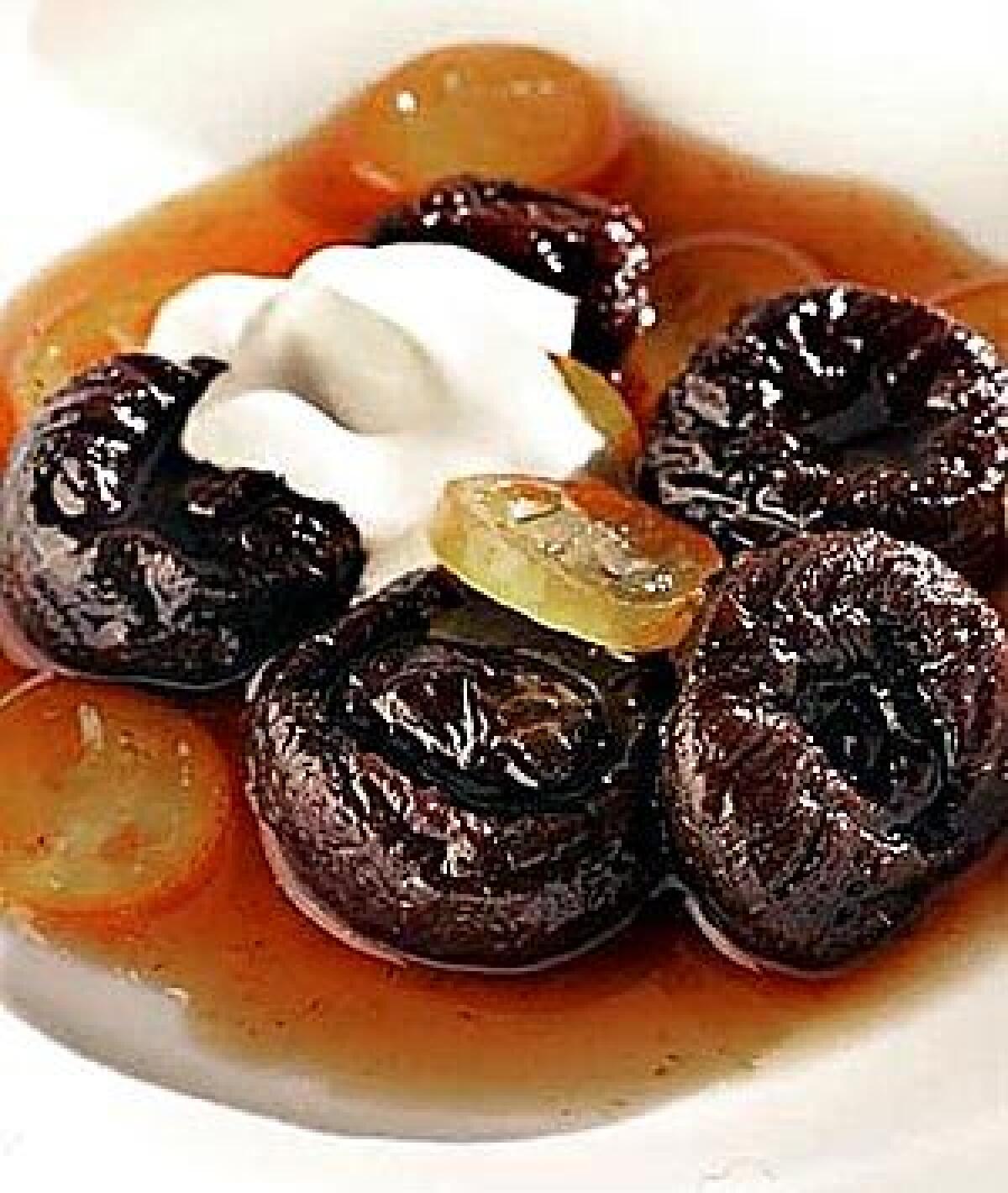 Tangy glazed kumquats perk up a bowl of poached prunes.