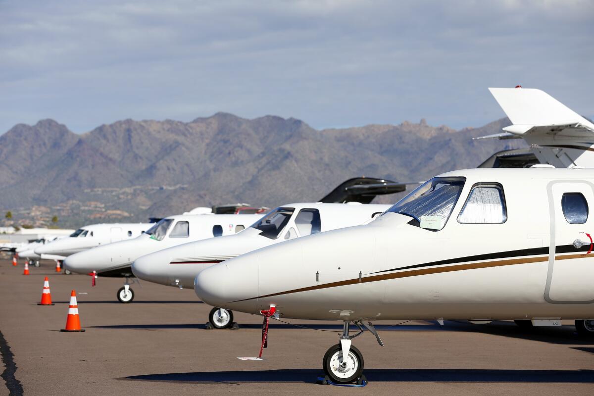 Private jets sit parked at Scottsdale Airport 