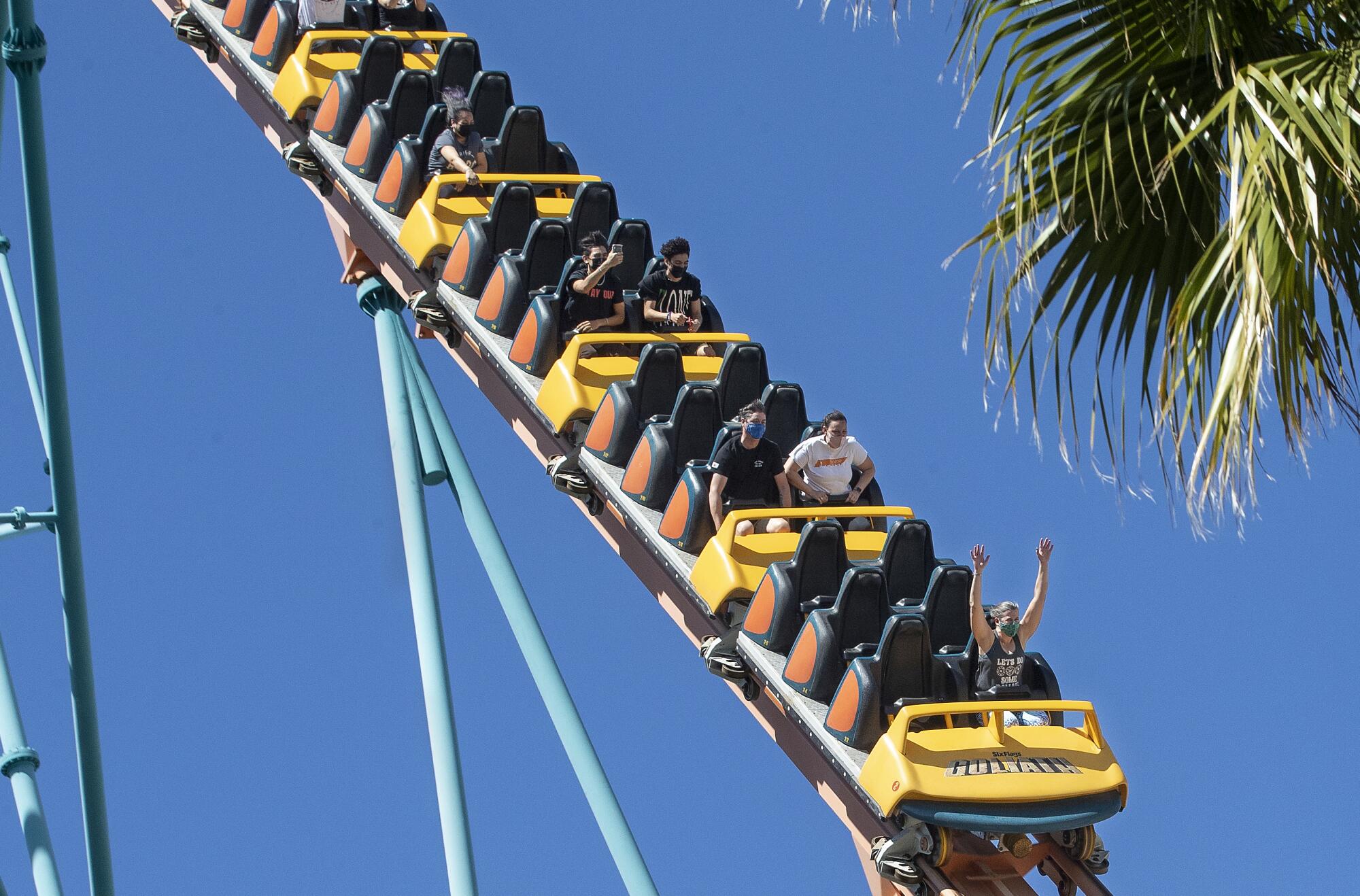 People ride the Goliath roller coaster at Six Flags Magic Mountain in Valencia.