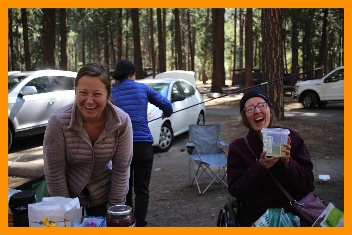 In a campground in Yosemite Valley, Kendall Obra laughs with Christina Roma, who takes a sip of pickle brine.