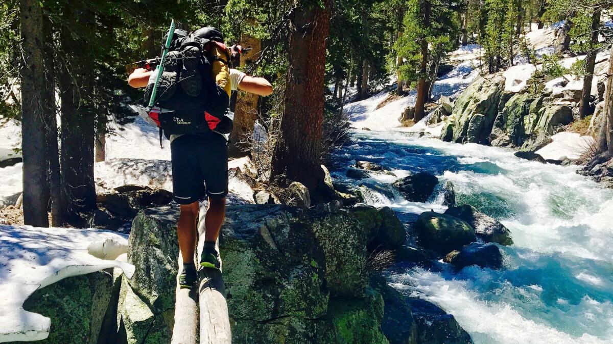 Jake Gustafson crosses Bear Creek along the Pacific Crest Trail near Kings Canyon National Park. Rangers there warned hikers to be careful around swift water.