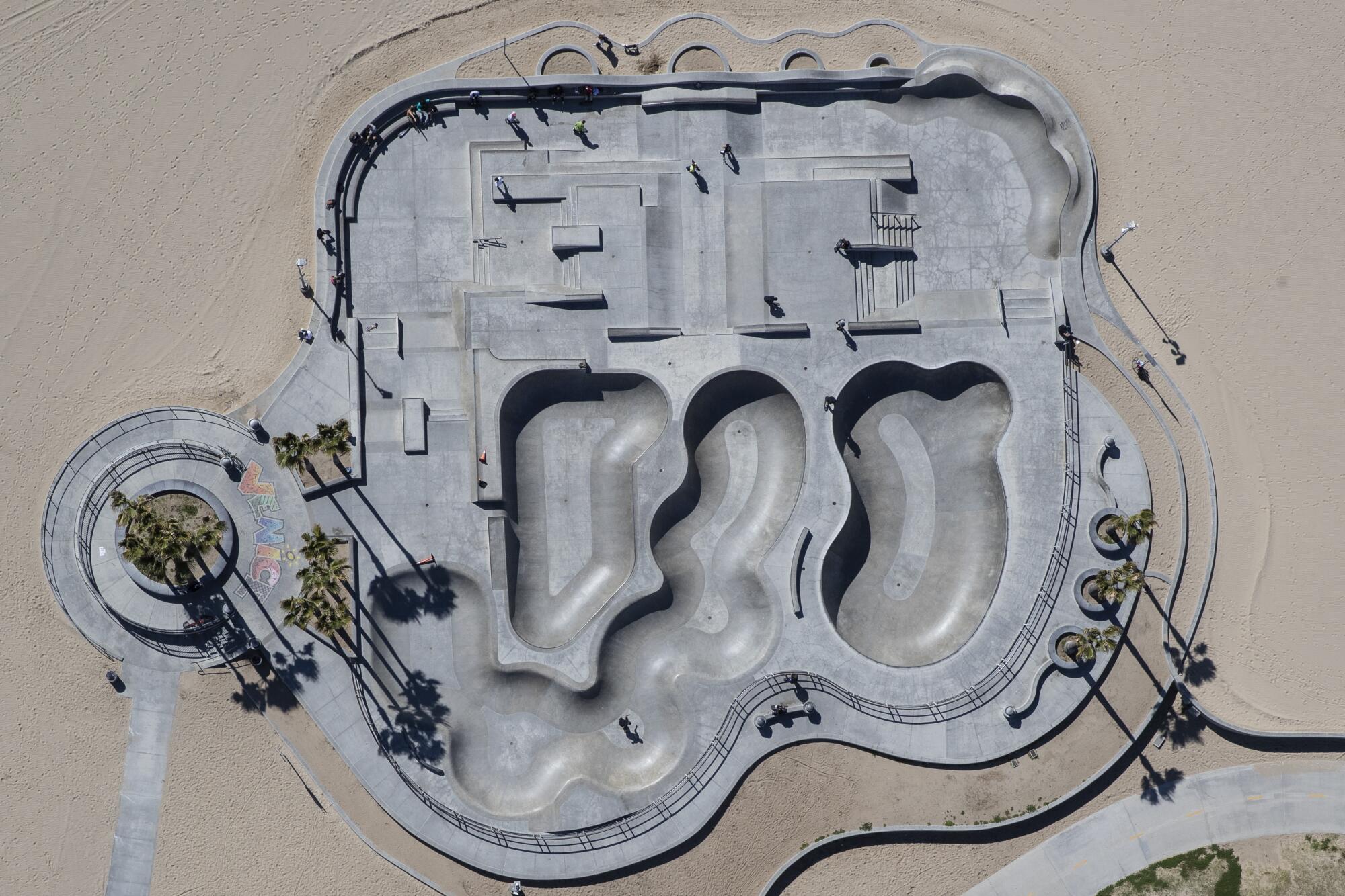 Aerial views of the Venice Beach skatepark where a handful of skaters defy the City's closure order.