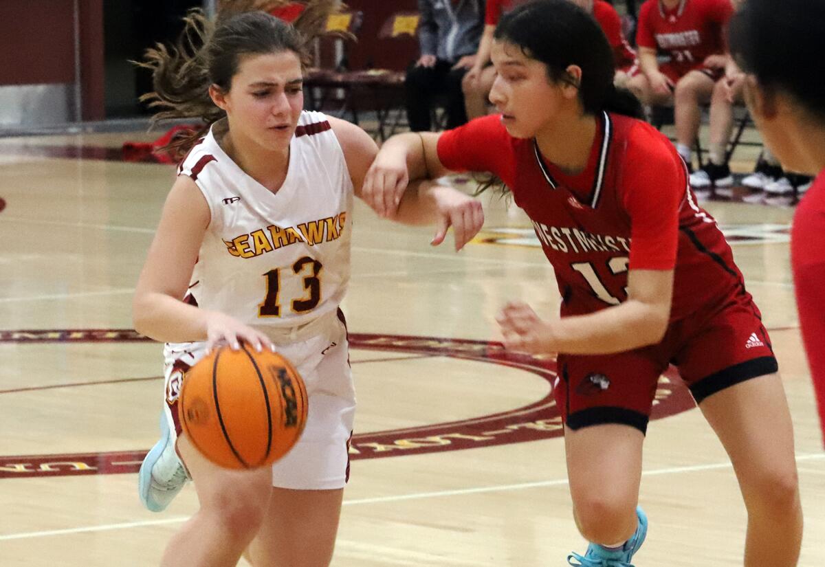 Ocean View's Angelina Bado, left, makes contact with Westminster's Kiana Salcedo during a Golden West League game .
