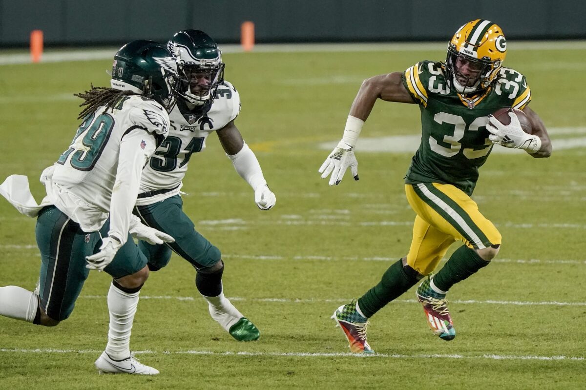Green Bay Packers running back Aaron Jones carries the ball against the Philadelphia Eagles on Sunday.
