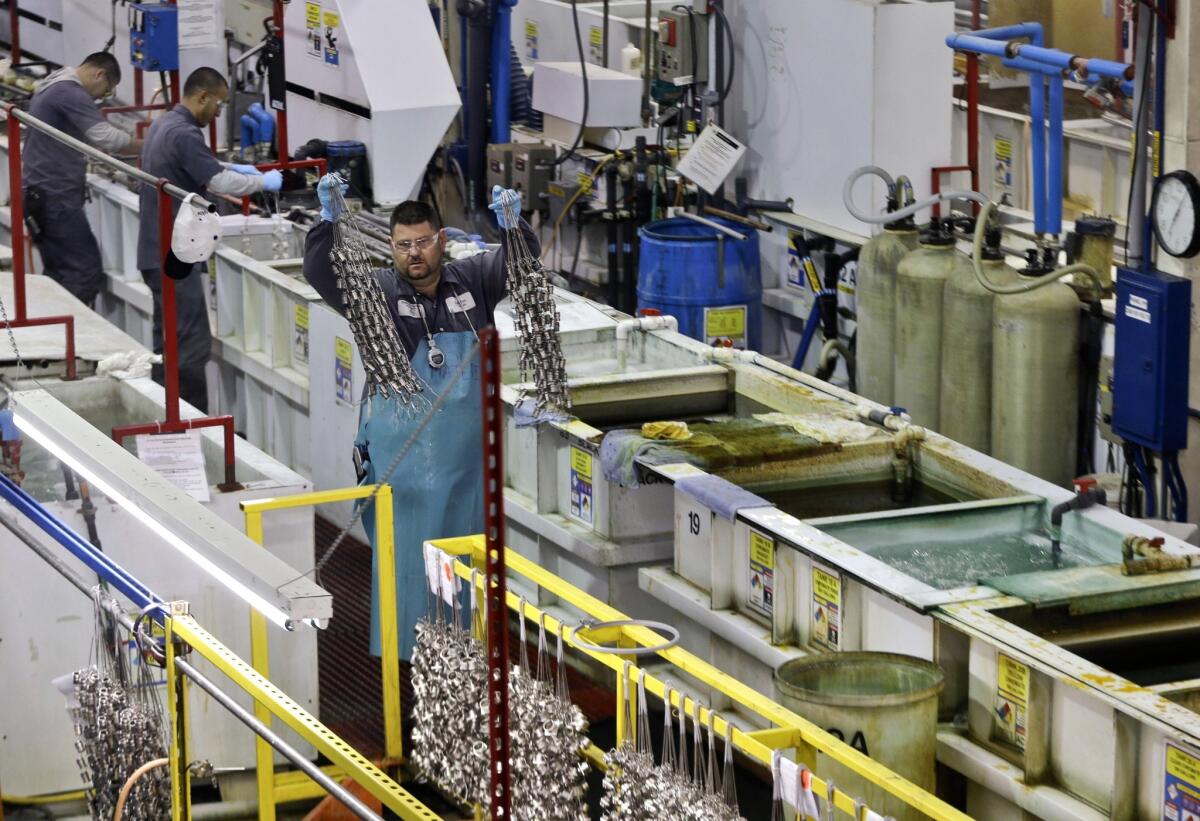 Worker productivity jumped in the third quarter, the Labor Department said Monday. Above, employees work in San Diego on the factory floor of Sheffield Platers Inc. in October.