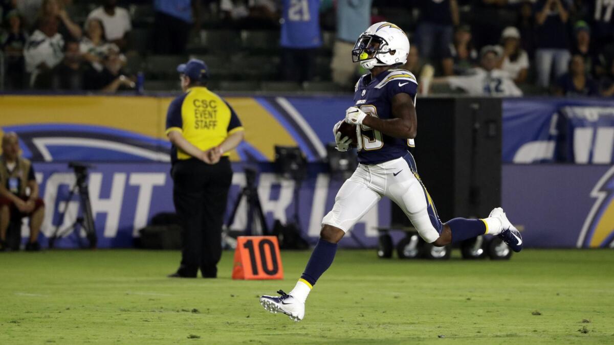 Chargers wide receiver JJ Jones returns a punt for a touchdown against the Seattle Seahawks.