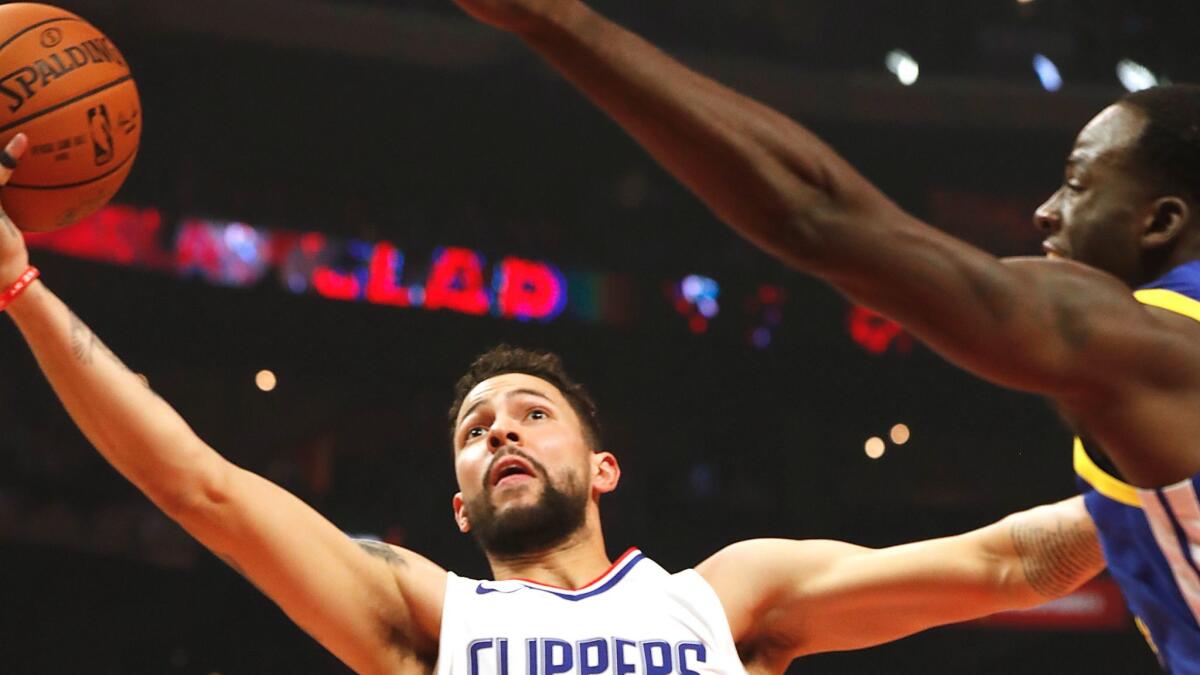 Clippers guard Austin Rivers looks for a basket against Golden State on Oct. 30 at Staples Center.