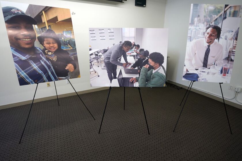 FILE - Pictures of Keenan Anderson, who was tasered multiple times during a struggle with Los Angeles police officers and died at a hospital, are displayed at news conference held by his family's attorney Jan. 20, 2023, in Los Angeles. Anderson, a teacher, died from an enlarged heart and cocaine use, according to an autopsy report released Friday, June 2. Anderson's death prompted an outcry over the Los Angeles Police Department's use of force. It was one of three fatal LAPD confrontations, including two shootings, that took place only days into the new year. (AP Photo/Damian Dovarganes, File)