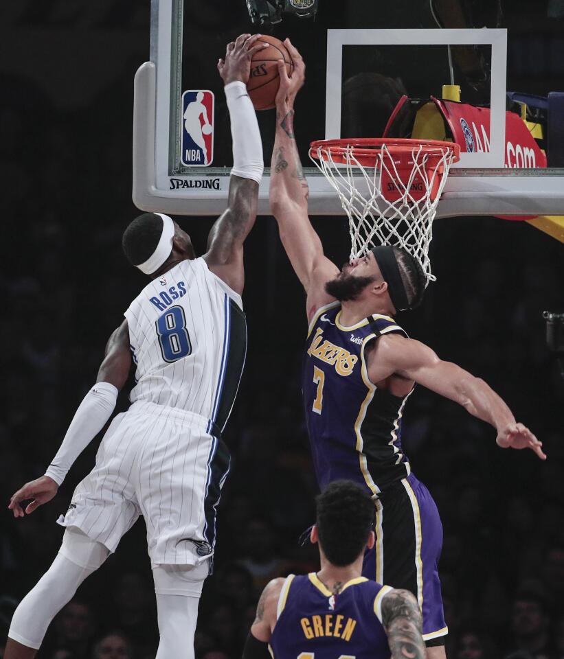 LOS ANGELES, CA, WEDNESDAY, JANUARY 15, 2020 - Los Angeles Lakers center JaVale McGee (7) stuffs Orlando Magic guard Terrence Ross (8) late in the first half at Staples Center. (Robert Gauthier/Los Angeles Times)