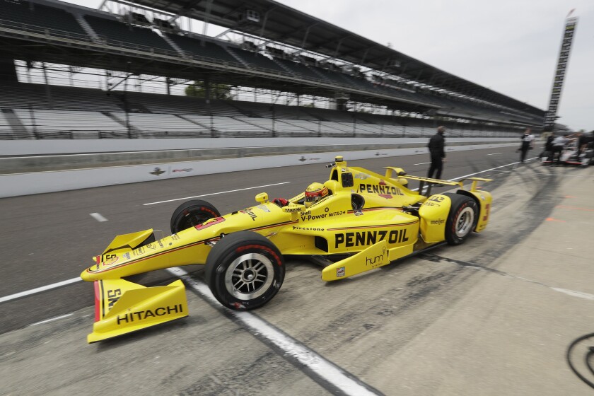Helio Castroneves of Brazil is in the seat for some test runs before the 100th Indianapolis 500 race on Memorial Day.