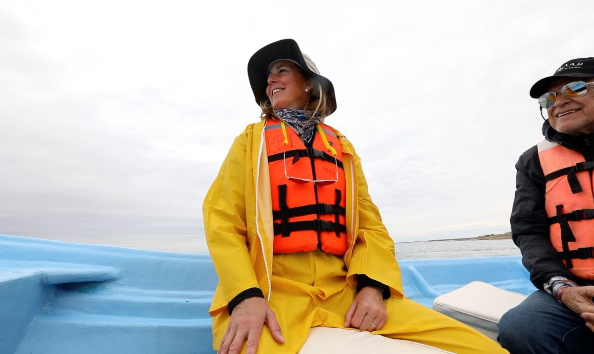 Susanne Rust sits on a boat