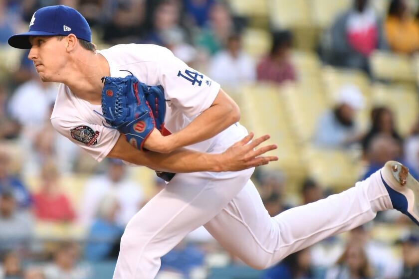LOS ANGELES, CALIFORNIA JUNE 8, 2018-Dodgers pitcher Walker Buehler throws a pitch against the Braves in the 1st inning at Dodger Stadium Friday. (Wally Skalij/Los Angeles Times)