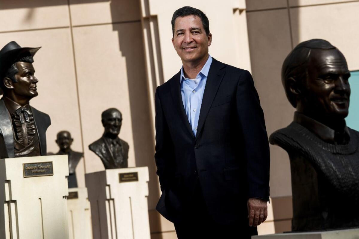 Bruce Rosenblum, chairman and CEO of the Television Academy, with some of the busts of past stars outside the academy's North Hollywood headquarters.