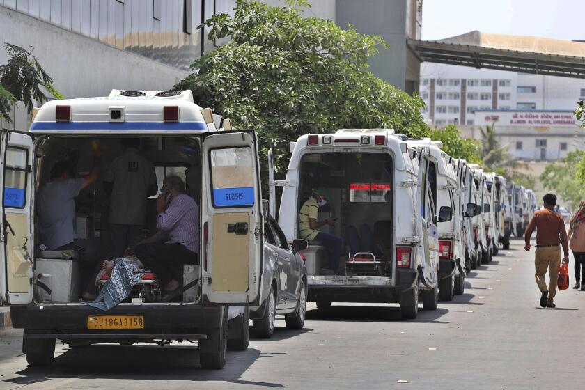 Ambulances carrying COVID-19 patients line up waiting for their turn to be attended to at a dedicated COVID-19 government hospital in Ahmedabad, India, Thursday, April 22, 2021. Indian authorities scrambled Saturday to get oxygen tanks to hospitals where COVID-19 patients were suffocating amid the world’s worst coronavirus surge, as the government came under increasing criticism for what doctors said was its negligence in the face of a foreseeable public health disaster. (AP Photo/Ajit Solanki)