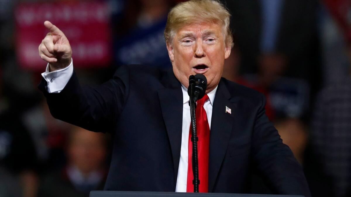 President Trump speaks to supporters at a rally in Topeka, Kan., on Saturday.