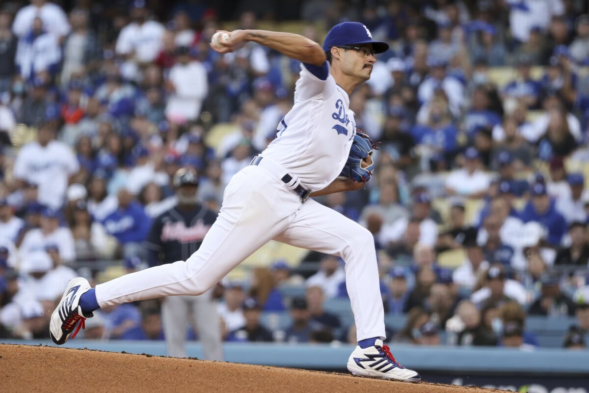 Dodgers starting pitcher Joe Kelly delivers a pitch during the first inning in Game 5 of the NLCS.