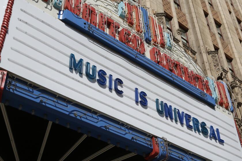 An old-fashioned movie-theater marquee that reads "Music is universal."