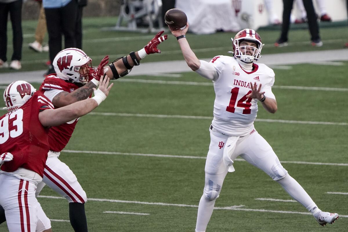 Indiana's Jack Tuttle throws a pass against Wisconsin on Saturday.