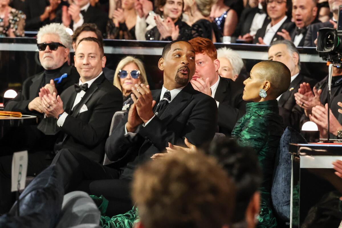 Will Smith and Jada Pinkett watch the show at the 94th Academy Awards.