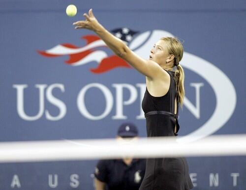 Maria Sharapova serves to No. 2 Justine Henin-Hardenne of Belgium in the U.S. Open women's singles final.