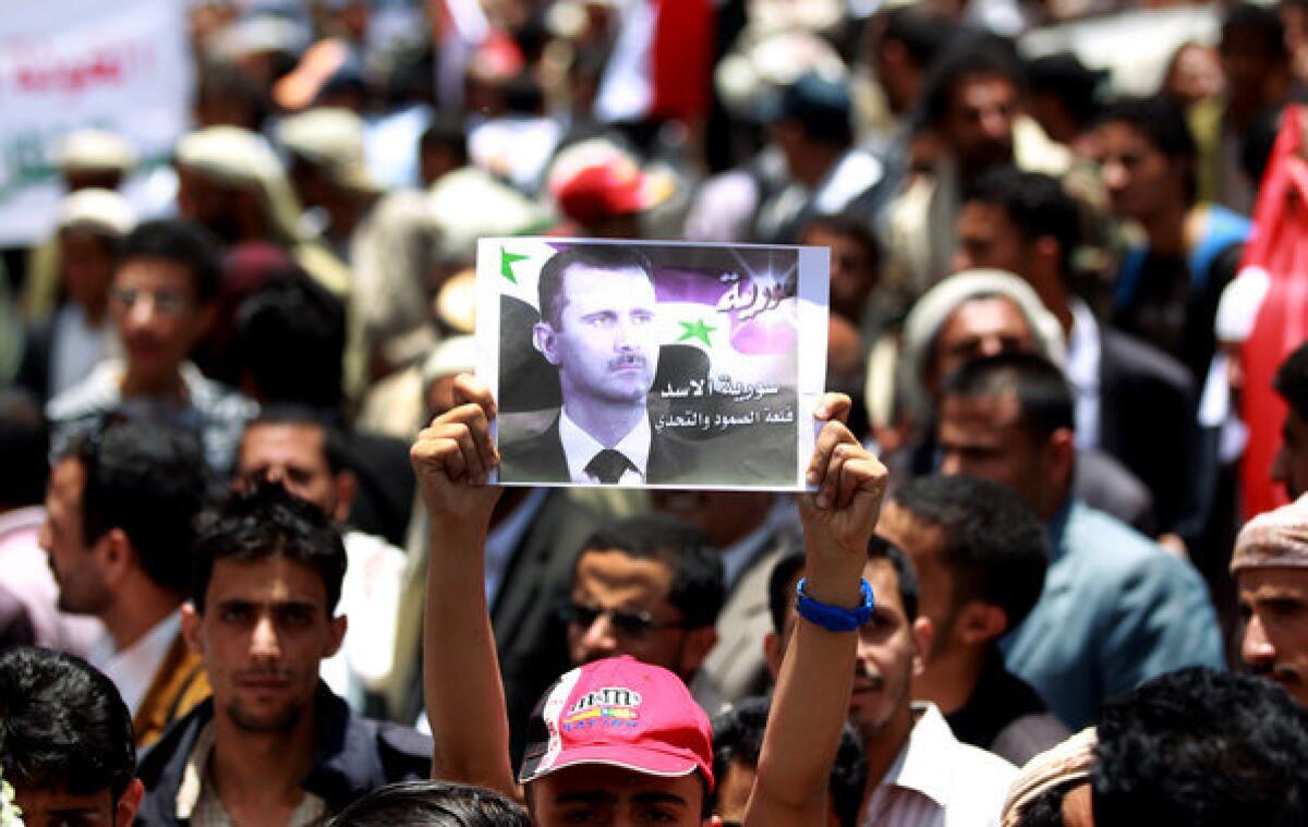 Supporters of Syrian President Bashar Assad march in the Yemeni capital, Sana, in protest of Israeli airstrikes on weapons convoys in Syria. Israel claims a right to prevent sophisticated arms from being acquired by the Hezbollah militia, although it has yet to confirm it waged the recent attacks.