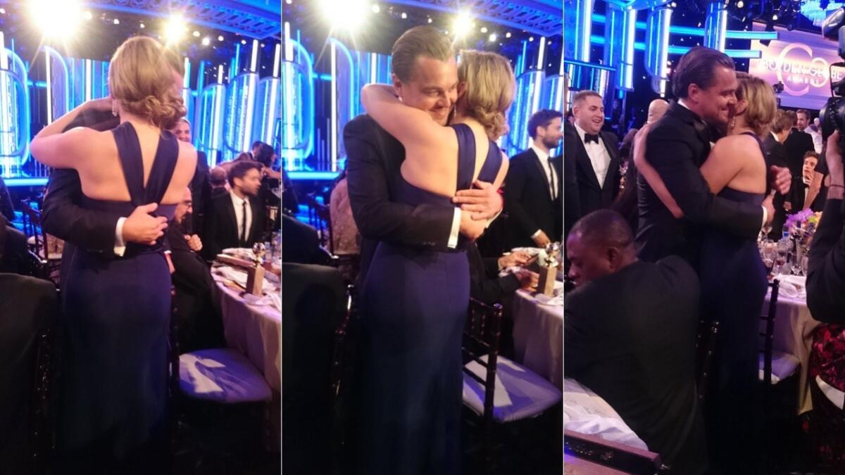Kate Winslet runs over to Leonardo DiCaprio and gives him a big hug after he won the Golden Globe for actor in a motion picture, drama, for his work in "The Revenant."